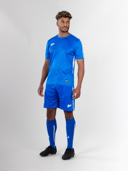 The man is wearing royal blue football shorts with a graphic print football shirt