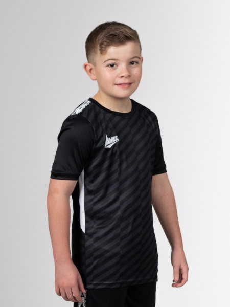 This young boy is looking very happy wearing a junior black football shirt.