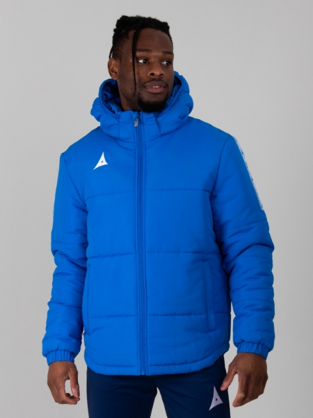 A man wearing a royal blue padded jacket. 