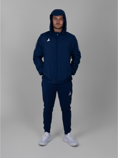 A man is standing up with the rain hood over his head. The Navy Rain Jacket has white sleeve details.