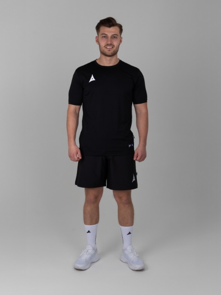 man wearing a black training t-shirt and black woven shorts