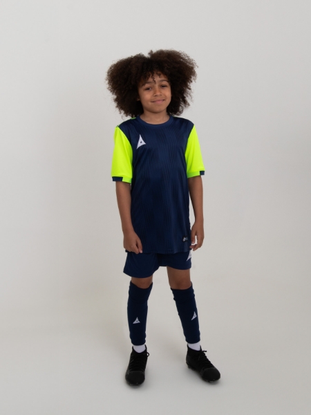 A kids football kit in navy blue with yellow sleeves