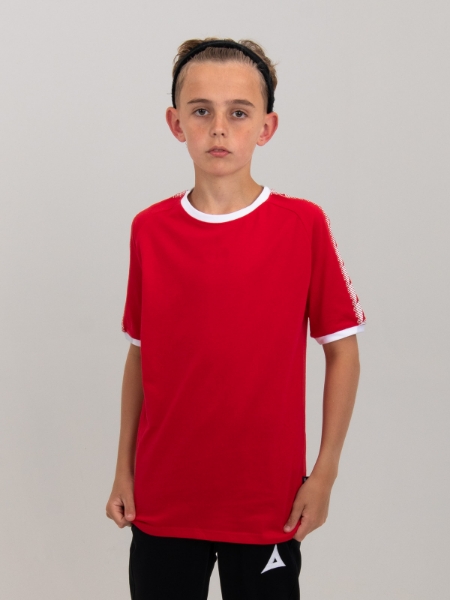 A kids red cotton t-shirt is being worn by a boy