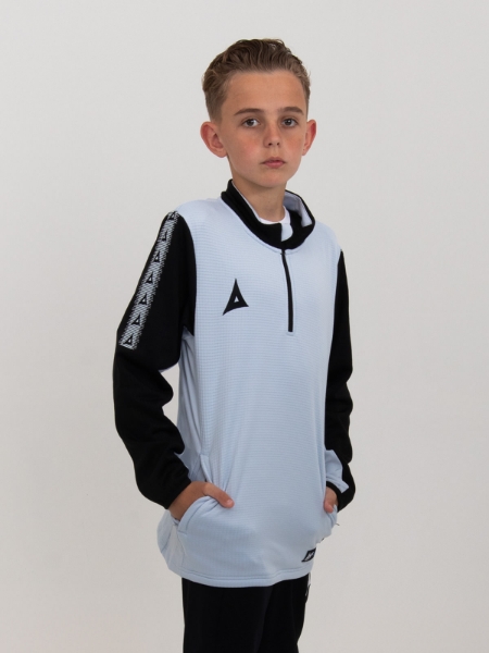 A young child is wearing a soft feel grey jumper with black sleeves and details.