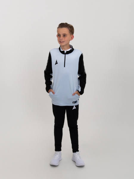 The child in this image is wearing a light grey sweat top in a junior size alongside black joggers.