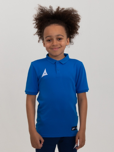 A child is smiling while wearing a plain royal blue sports polo