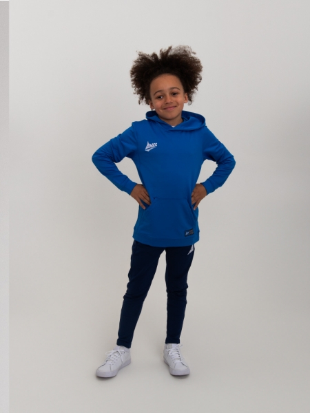 A boy is wearing a royal blue hoody that goes over the head.