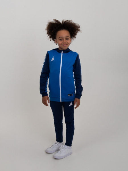 A boy is wearing a kids hoody in blue with blue jogging bottoms