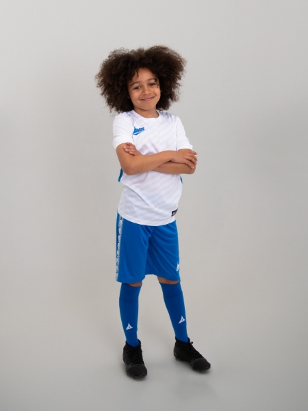 A pair of childrens royal blue shorts are pairs with a white football shirt for an iconic look.