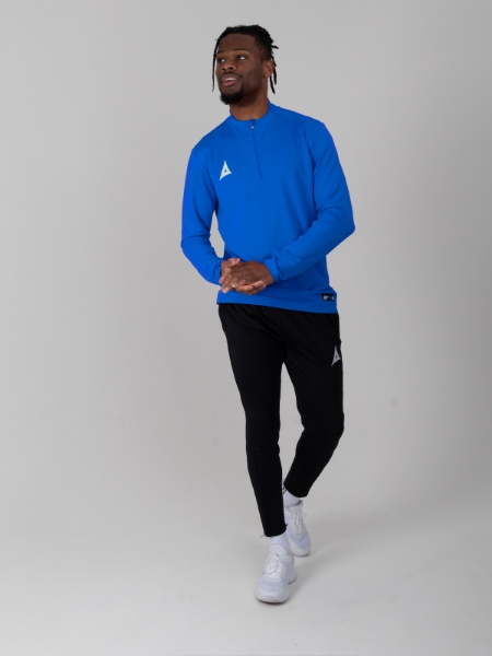 This man is wearing a plain royal blue jumper with zip and black jogger bottoms