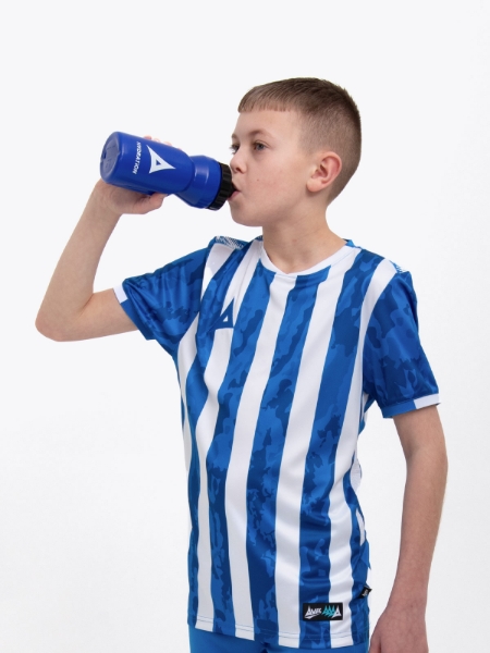 A kid is wearing a Royal Blue football shirt with white stripes and is drinking from a matching royal blue water bottle with a self sealing nozzle