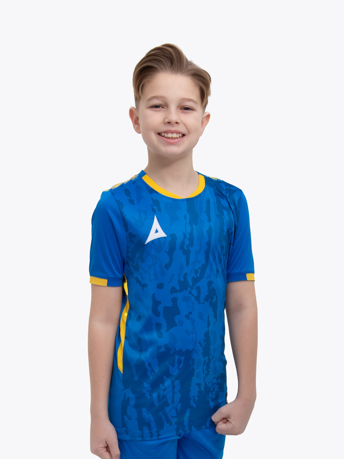 a model standing up wearing a royal blue football shirt, with yellow details