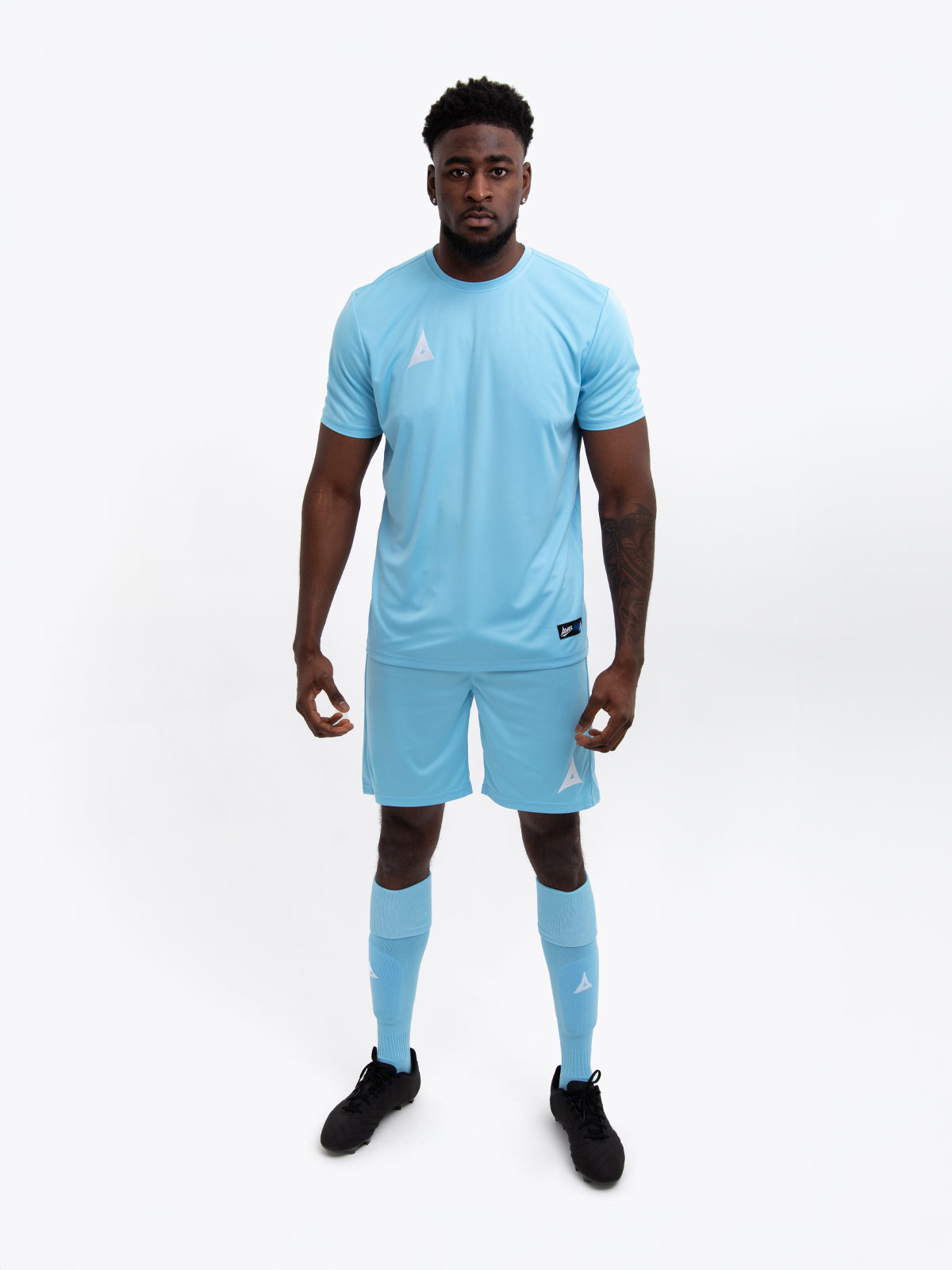 an adults football kit in sky and matching sky blue shorts and socks