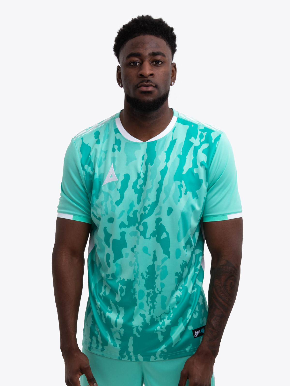 model wearing a mint green / hyper green sports football training t-shirt.