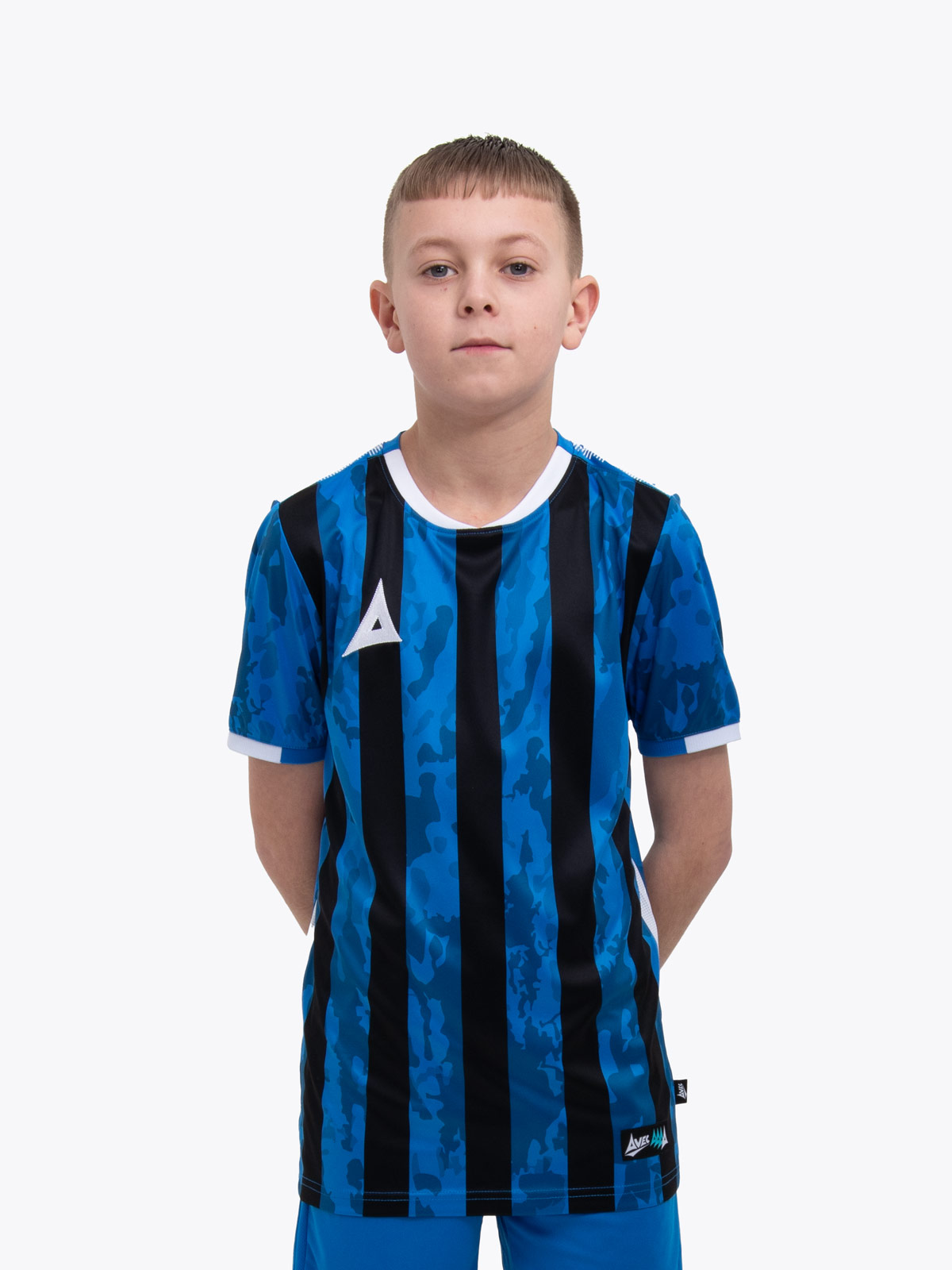 a young child is wearing a royal blue and black striped football shirt. the football shirt has a camo pattern
