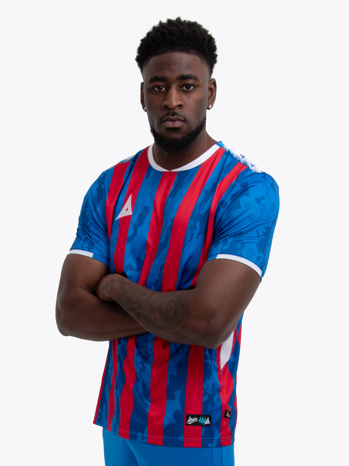 model wearing a red and royal blue stripe sports football training t-shirt.