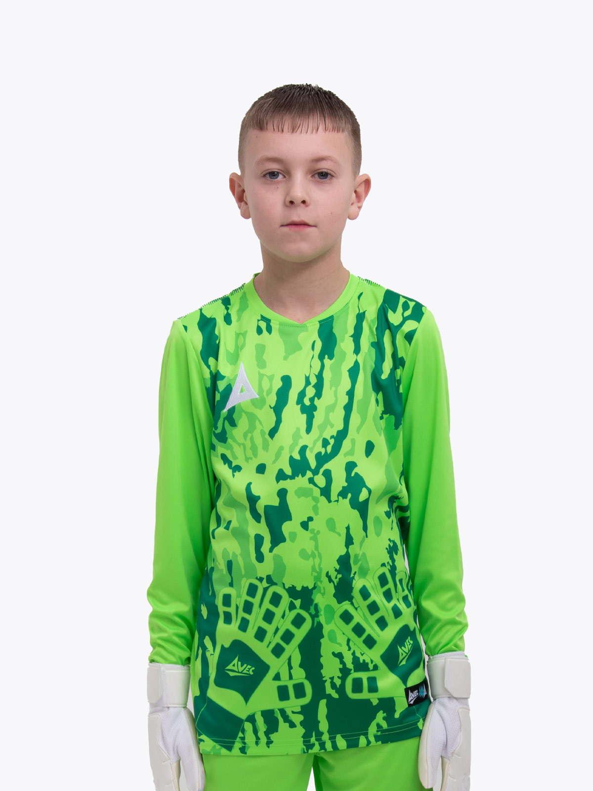 a kid wearing a neon green goalkeeper football shirt with a camo pattern