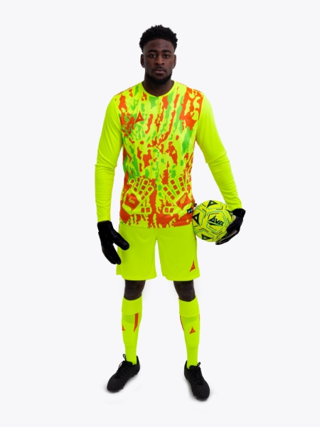 Man is wearing a neon yellow goalkeeper football shirt with orange accents and a neon yellow football