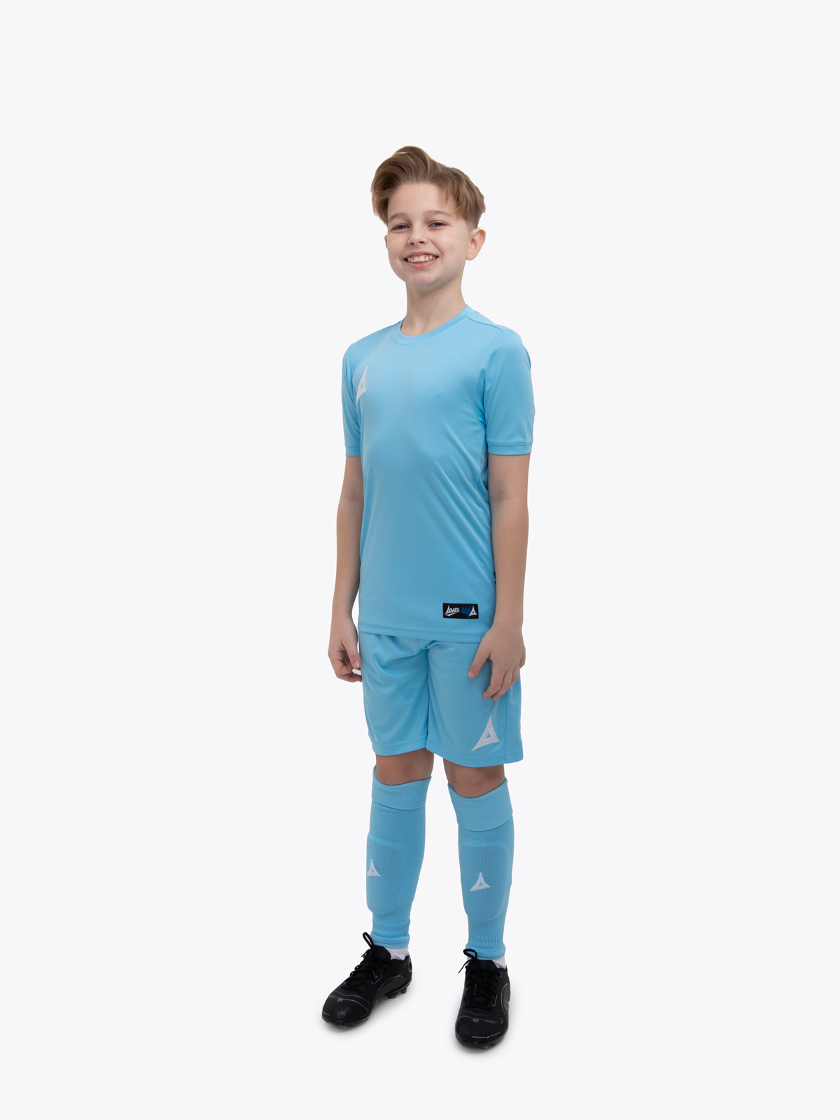 a child is wearing a hyper sky football shirt with matching shorts and socks